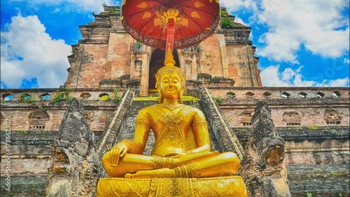 Time lapse beautiful sky Pagoda and buddha statue at Wat Chedi Luang temple in Chiang Mai  Thailand photo