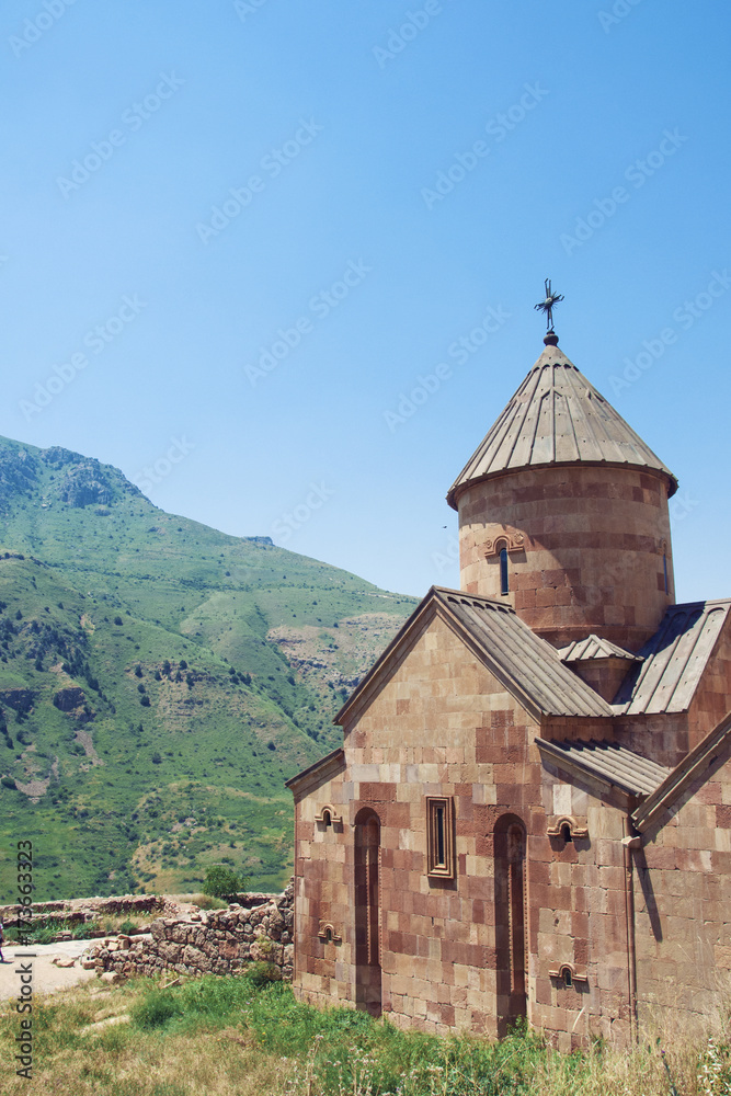 Ancient Monastery Noravank built of natural stone tuff. The city of Yeghegnadzor, Armenia. Landscape view of the mountains.	