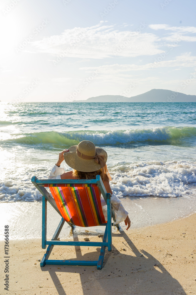 woman relaxing on sun bed sofa lounge chair on holidays woman relaxing on sun bed sofa lounge chair on holidays