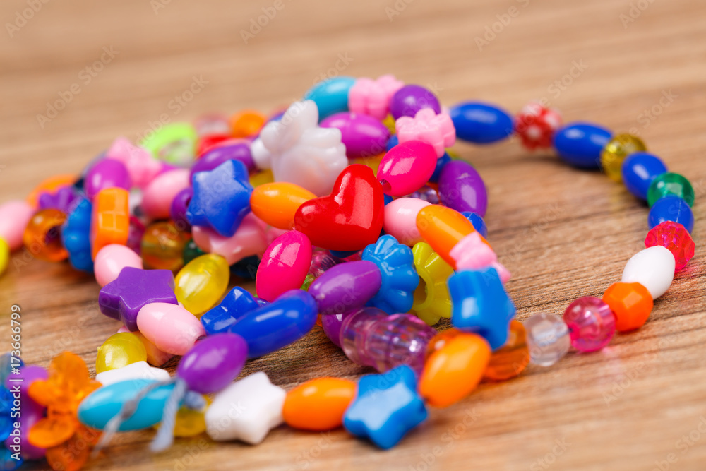 bead bracelet with beautiful handcrafted wooden background bead bracelet with beautiful handcrafted wooden background