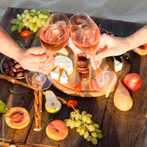 Refreshing Rosa Wine in a Glass . Beach Cheers Celebration Friendship Summer Fun Dinner Concept.