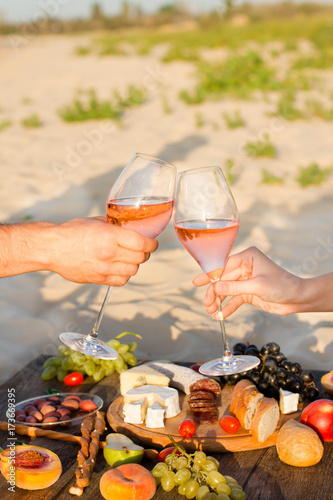 Obraz na płótnie Refreshing Rosa Wine in a Glass . Beach Cheers Celebration Friendship Summer Fun Dinner Concept. w salonie