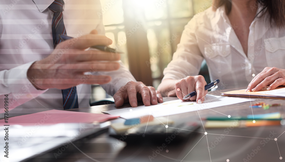 © thodonal - Senior manager working with executive assistant, double exposure, light effect