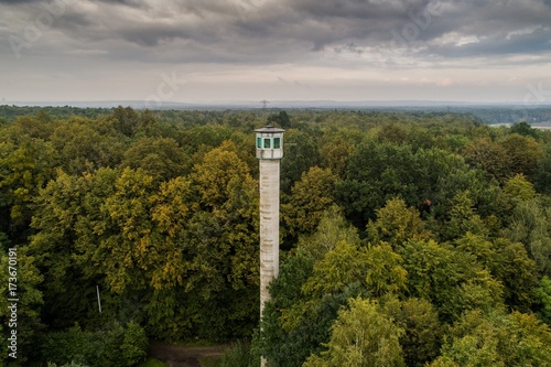 Tall watch tower in the forest.