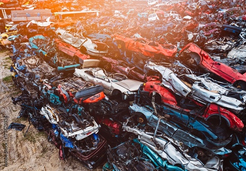 Destroyed scrapped cars stacked on a scrap yard.