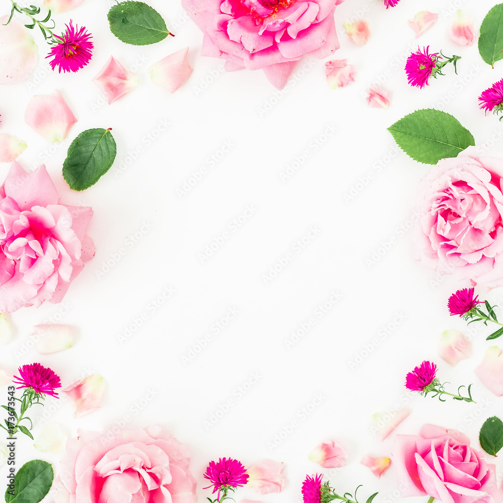 Floral frame with pink flowers, petals and leaves on white background. Flat lay, top view. Flower background