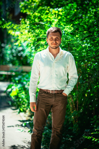 Handsome young man on nature background