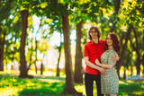 Beautiful young couple on the park background
