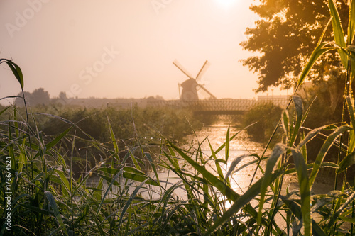 Misty windmill in The Netherlands