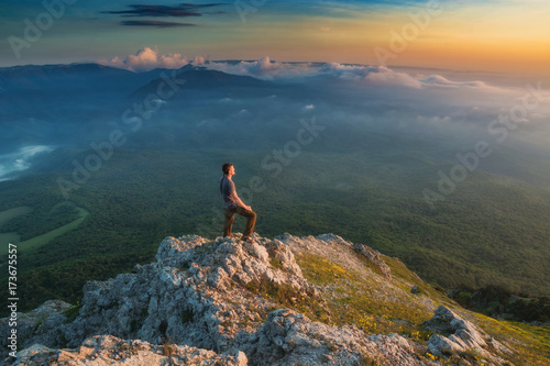 Human standing on a rocky mountain top