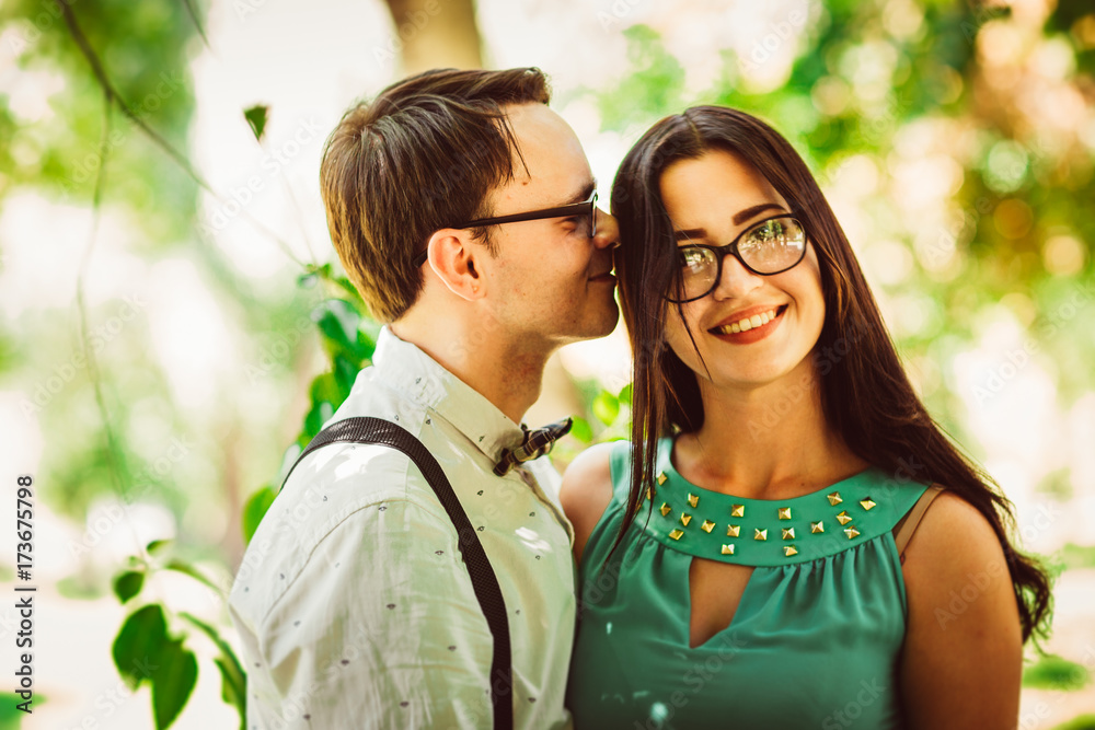 Fototapeta premium Beautiful young couple on the park background
