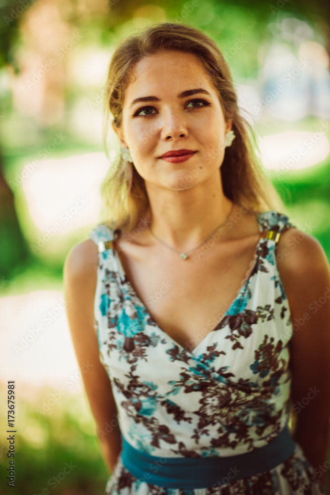 Young beautiful girl in floral dress Young beautiful girl in floral dress