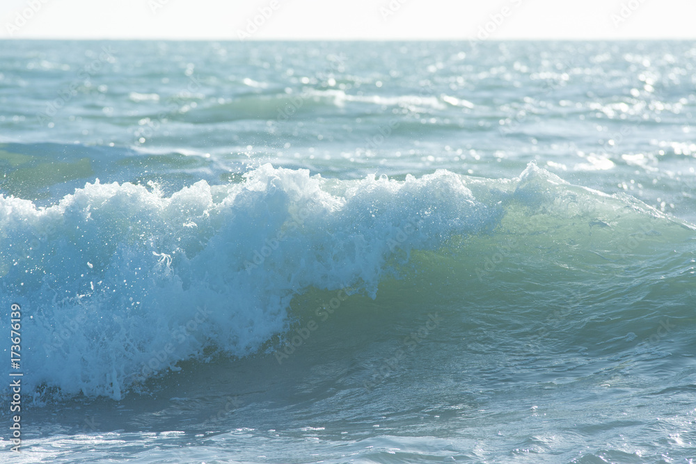 Fototapeta premium mediterranean sea waves breaking background, green water