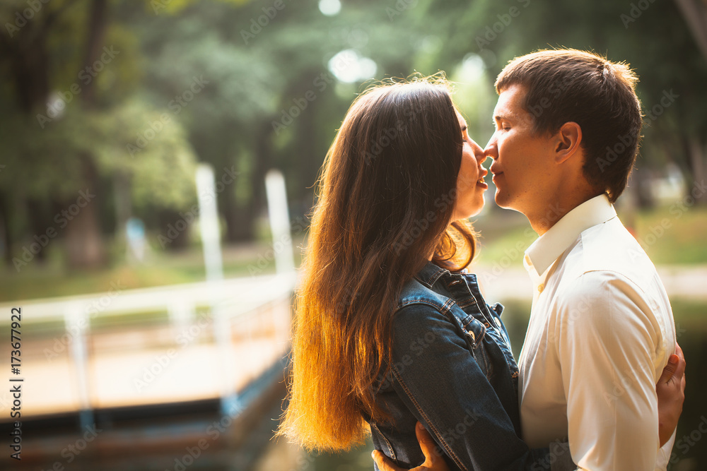 Beautiful young couple on the lake background Beautiful young couple on the lake background