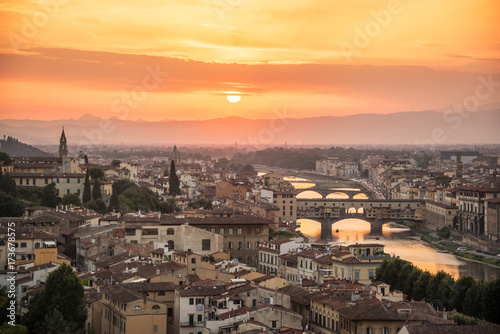 Aerial view of Florence at sunset with the Ponte Vecchio and the Arno river, Tuscany, Italy