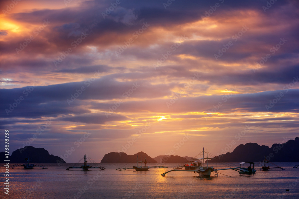 Beautiful sunset with fishing boats