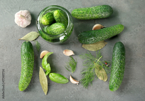 Ingredients for cucumbers pickling on gray background