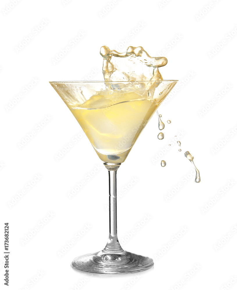 Glass of lemon drop martini with splash on white background