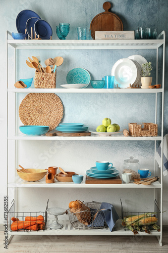 Storage stand with colorful kitchenware indoors