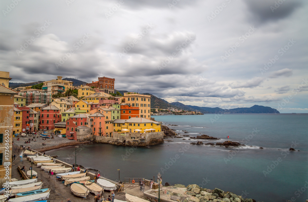 GENOA (GENOVA), ITALY, SEPTEMBER, 16, 2017 - Long exposure photo of Genoa Boccadasse under a cloudy sky, a fishing village and colorful houses in Genoa, Italy