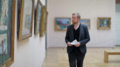 Wallpaper Mural Man in a Suit Looks at a Picture in a Museum Torontodigital.ca