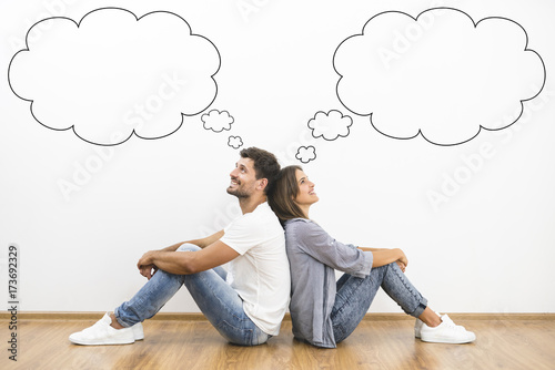 The happy man and woman dream near the wall with a bubbles