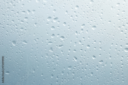 Light rain on the window glass, grainy texture on background