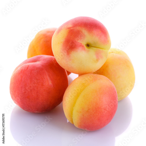 Fresh organic peaches isolated on white background