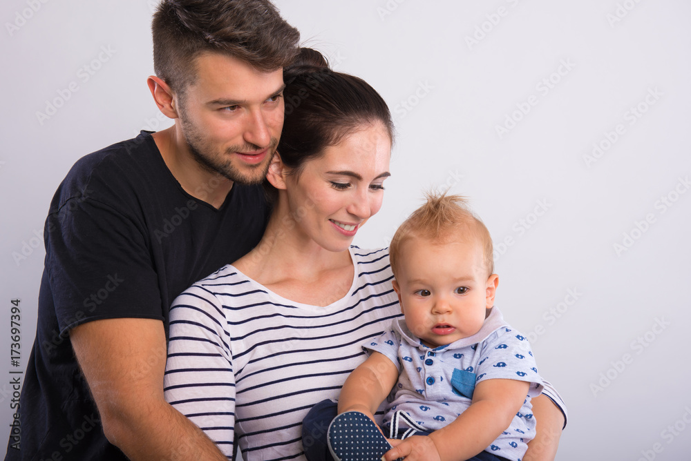 Beautiful young couple with a little boy . Beautiful young couple with a little boy .