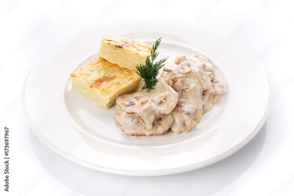 Delicious lunch. Casserole with mushroom sauce on white