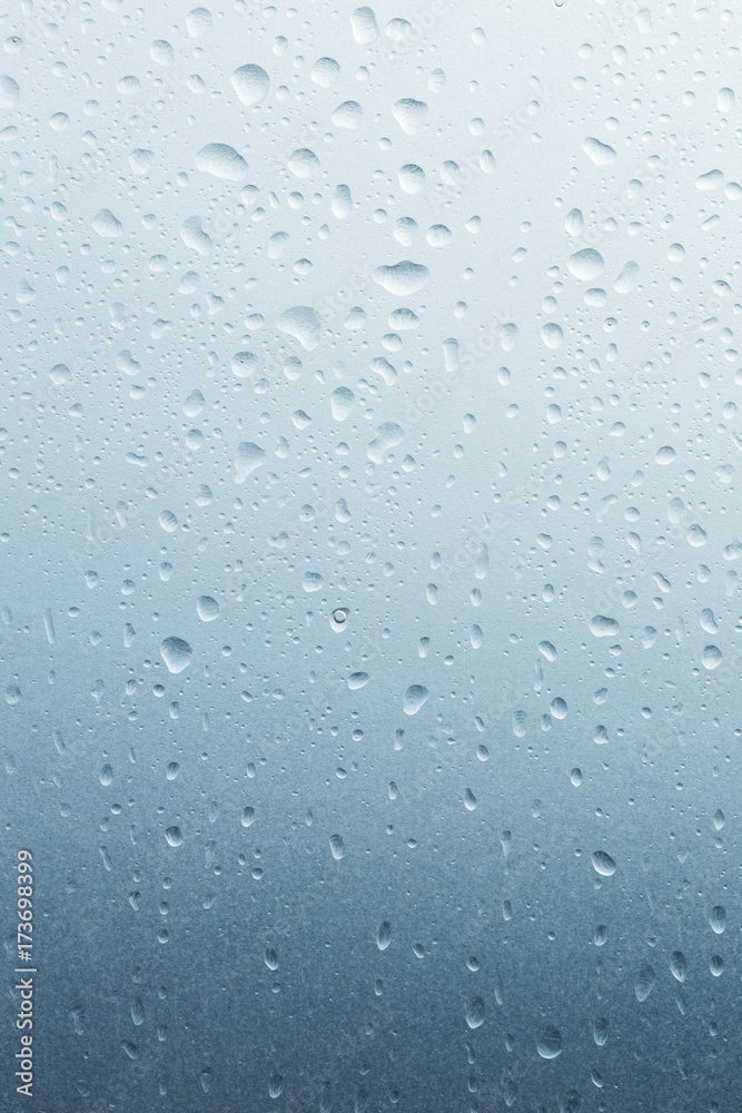 Light rain on the window glass, grainy texture on background Light rain on the window glass, grainy texture on background