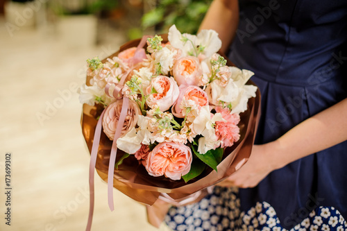 Wallpaper Mural Woman holding a beautiful and soft flower composition Torontodigital.ca