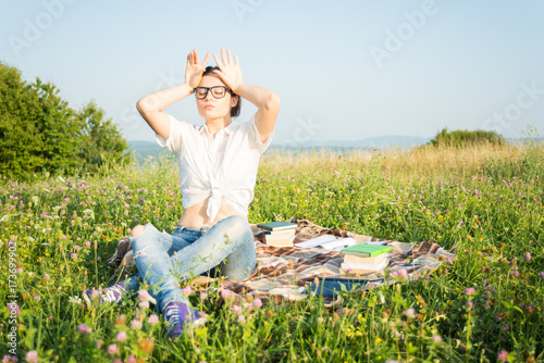 Female with glasses relaxing outside