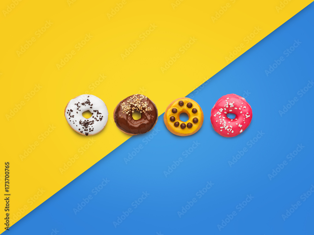 Sweet doughnuts on colorful background
