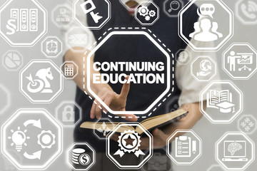Continuing Education Business School concept. Man using virtual touch innovative interface with continuing education text button.
