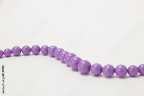 Necklace of beads on a white background