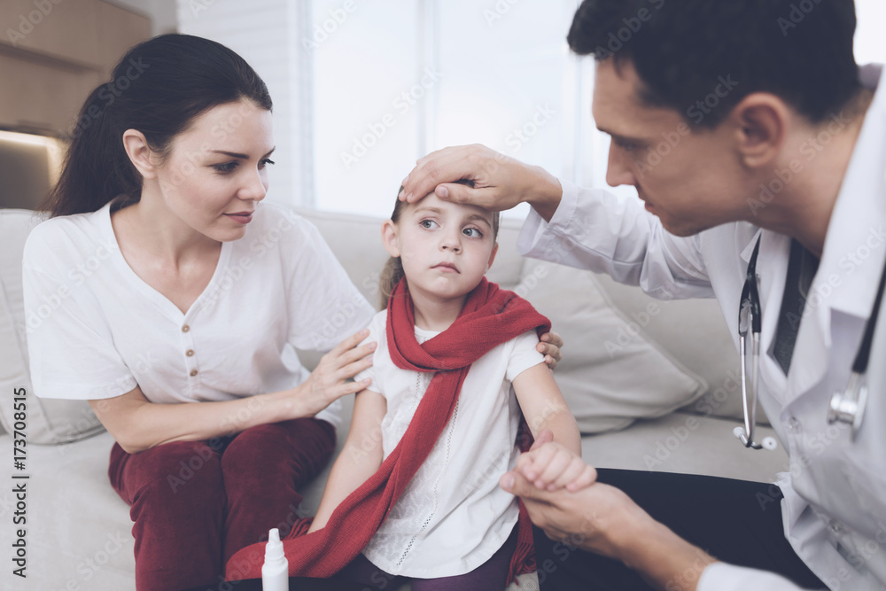 The little girl caught a cold. Her mother called the doctor at home. The doctor examines the girl