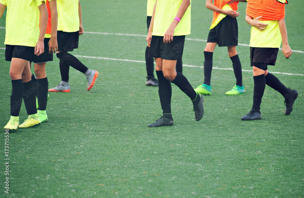 Unrecognizable players on the football field. Training. Unrecognizable players on the football field. Training.
