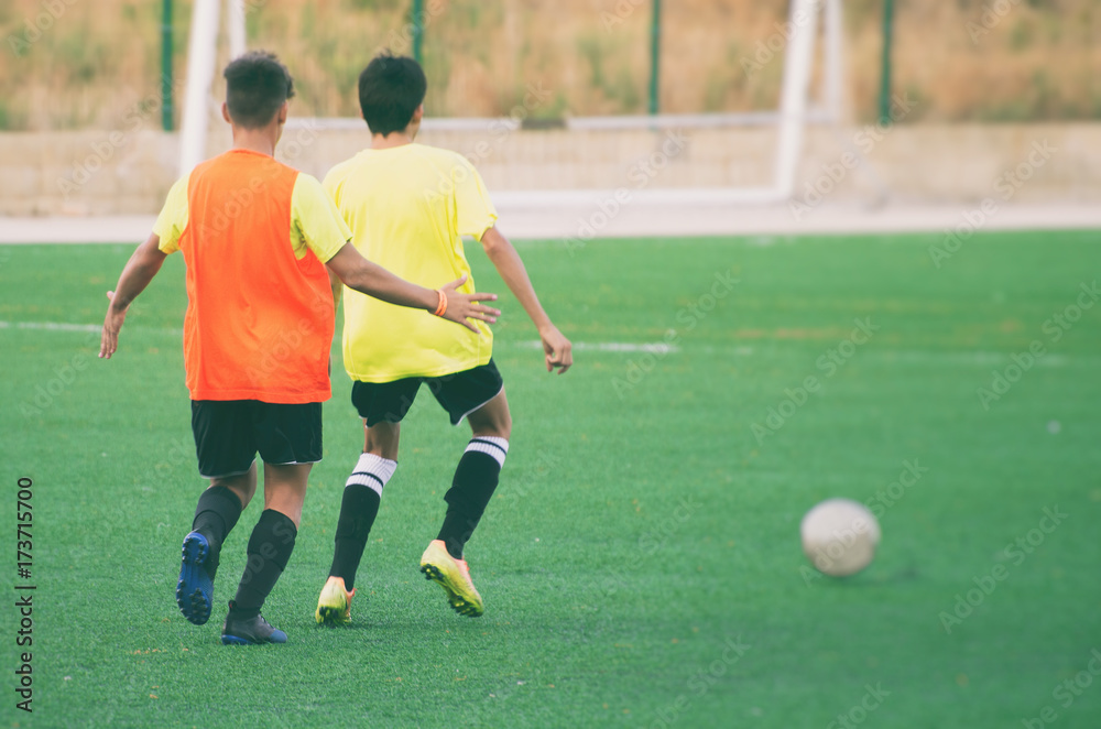 Obraz premium Unrecognizable players on the football field. Training.