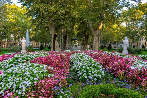View across flowers of the green promenade and the old vintage pavilion in Zrinjevac park in Zagreb, Croatia  © IKA