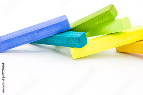 Colorful square pastel chalks on white background