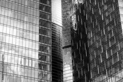 Reflection of a building in the windows of a large business building. Black and white.