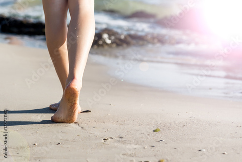 Beach travel - woman walking