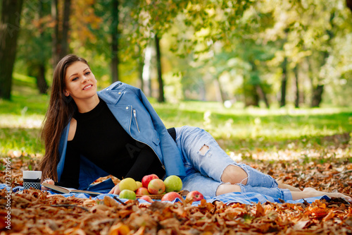 girl lying in the Park , beautiful girl resting , portrait of a happy