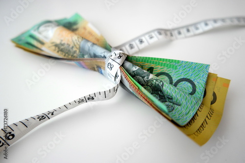 Tape measure tightly wrap Australian banknotes