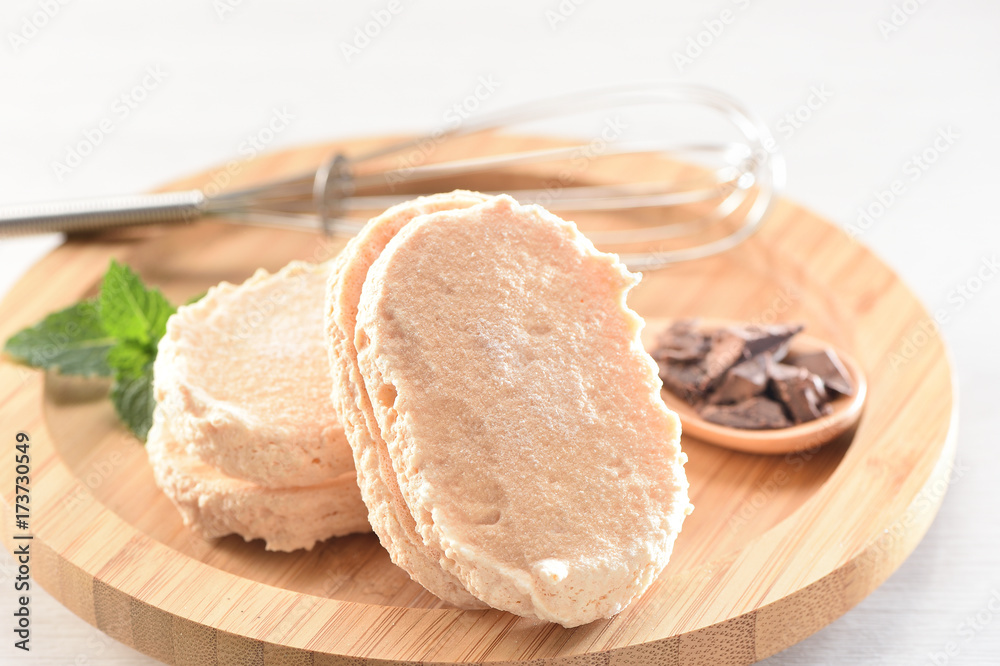 Dacquoise (French pronunciation) is a dessert cake made with layers of almond and hazelnut meringue and whipped cream or buttercream. Dacquoise (French pronunciation) is a dessert cake made with layers of almond and hazelnut meringue and whipped cream or buttercream.
