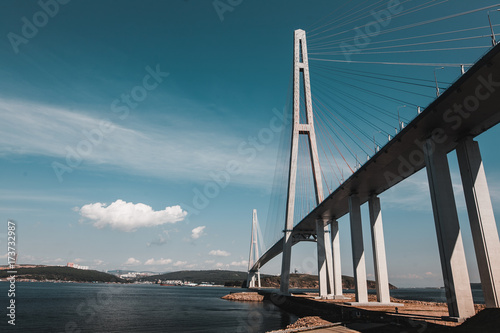 Magnificent view of the cable-stayed bridge from the mainland to the island across the strait, beautiful sea background