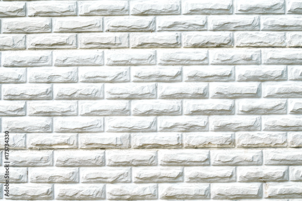 Texture of white brick wall surface with cement and concrete seams