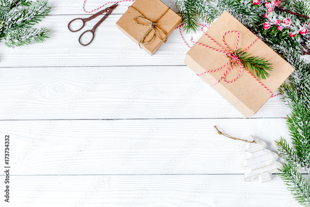 gifts boxes with fir branches on wooden background top view gifts boxes with fir branches on wooden background top view