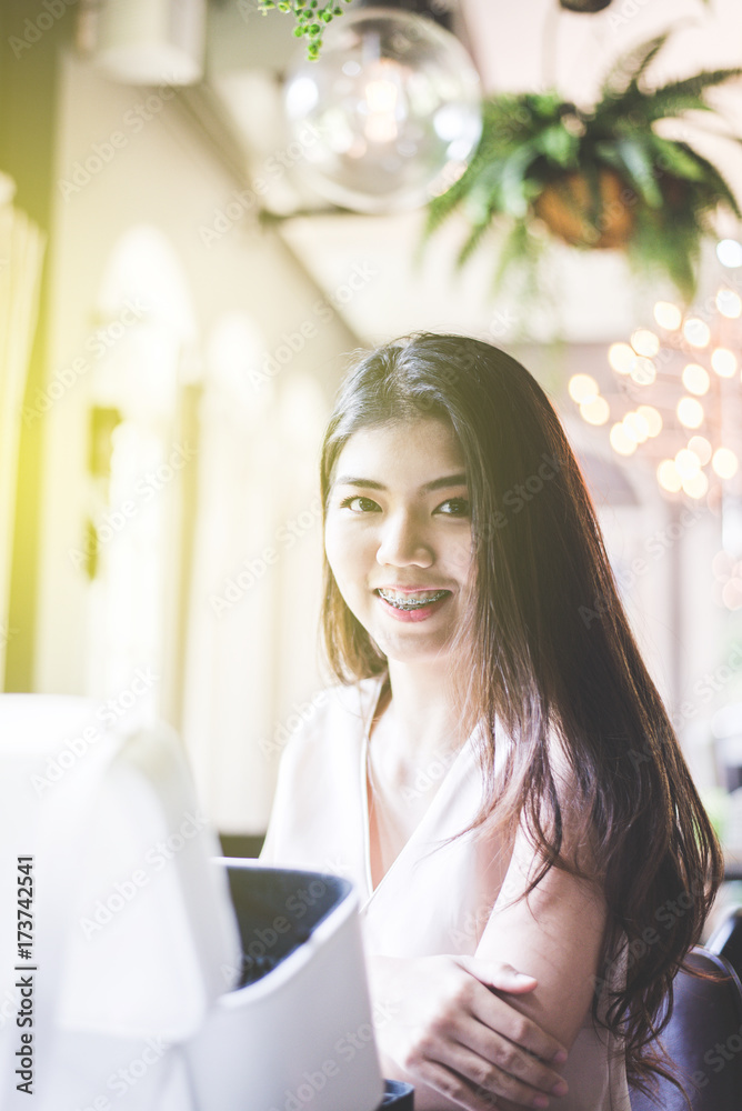 Portrait a beautiful asian woman smiling and looking camera Portrait a beautiful asian woman smiling and looking camera